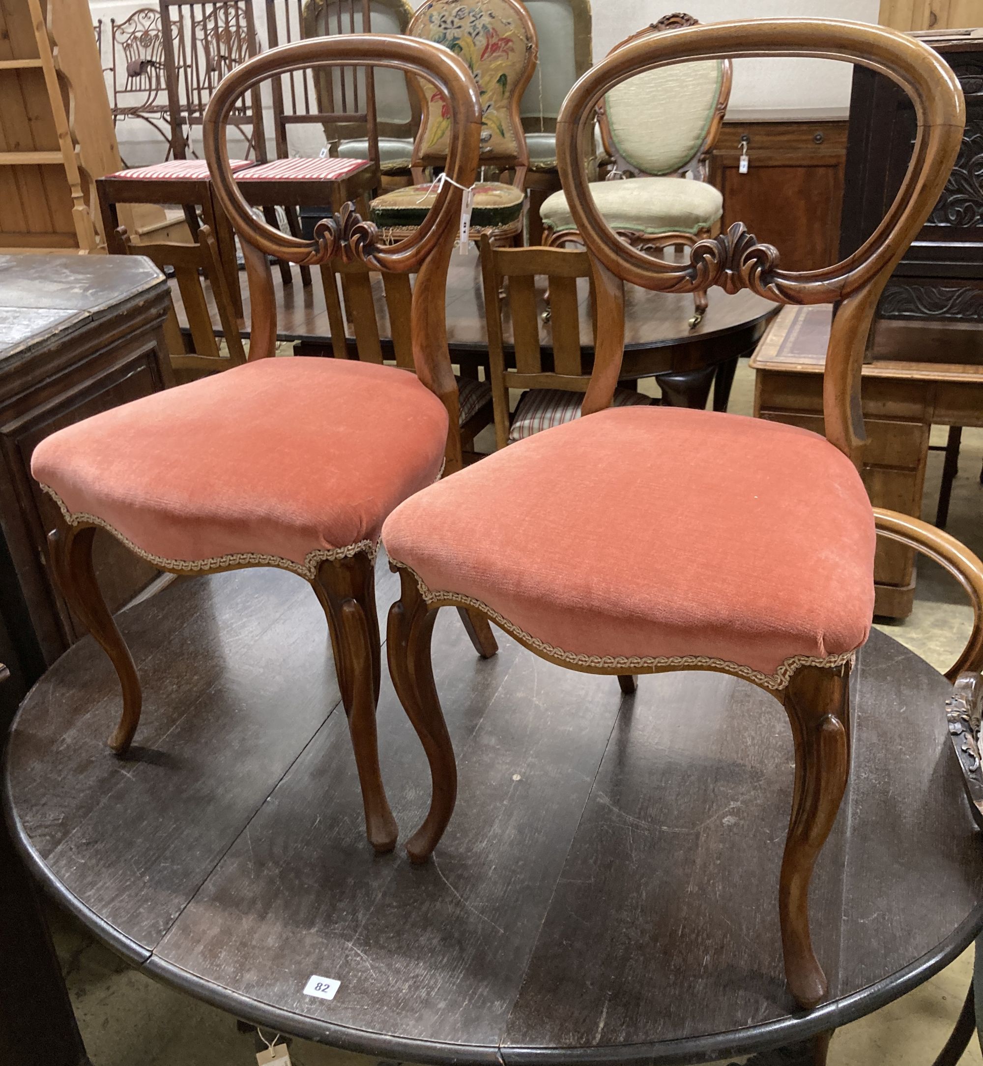 A set of four Victorian mahogany balloon back dining chairs